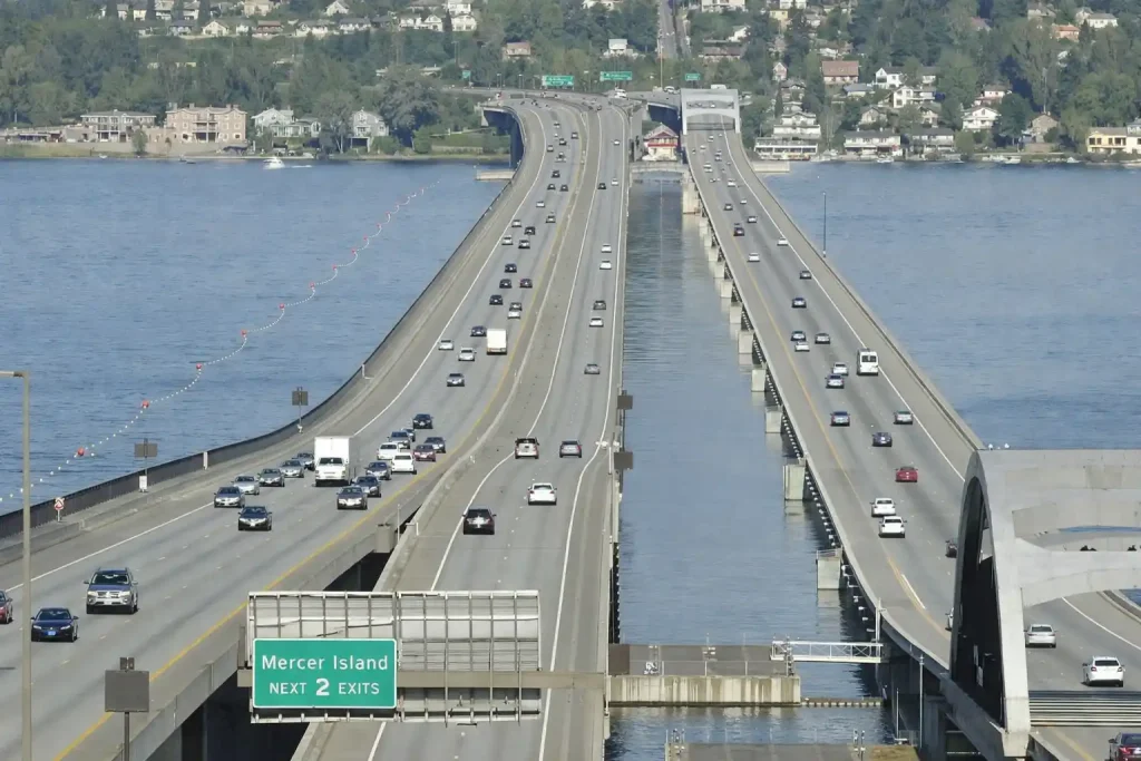 Luxury town car crossing SR-520 floating bridge from Medina to downtown Seattle with Lake Washington views
