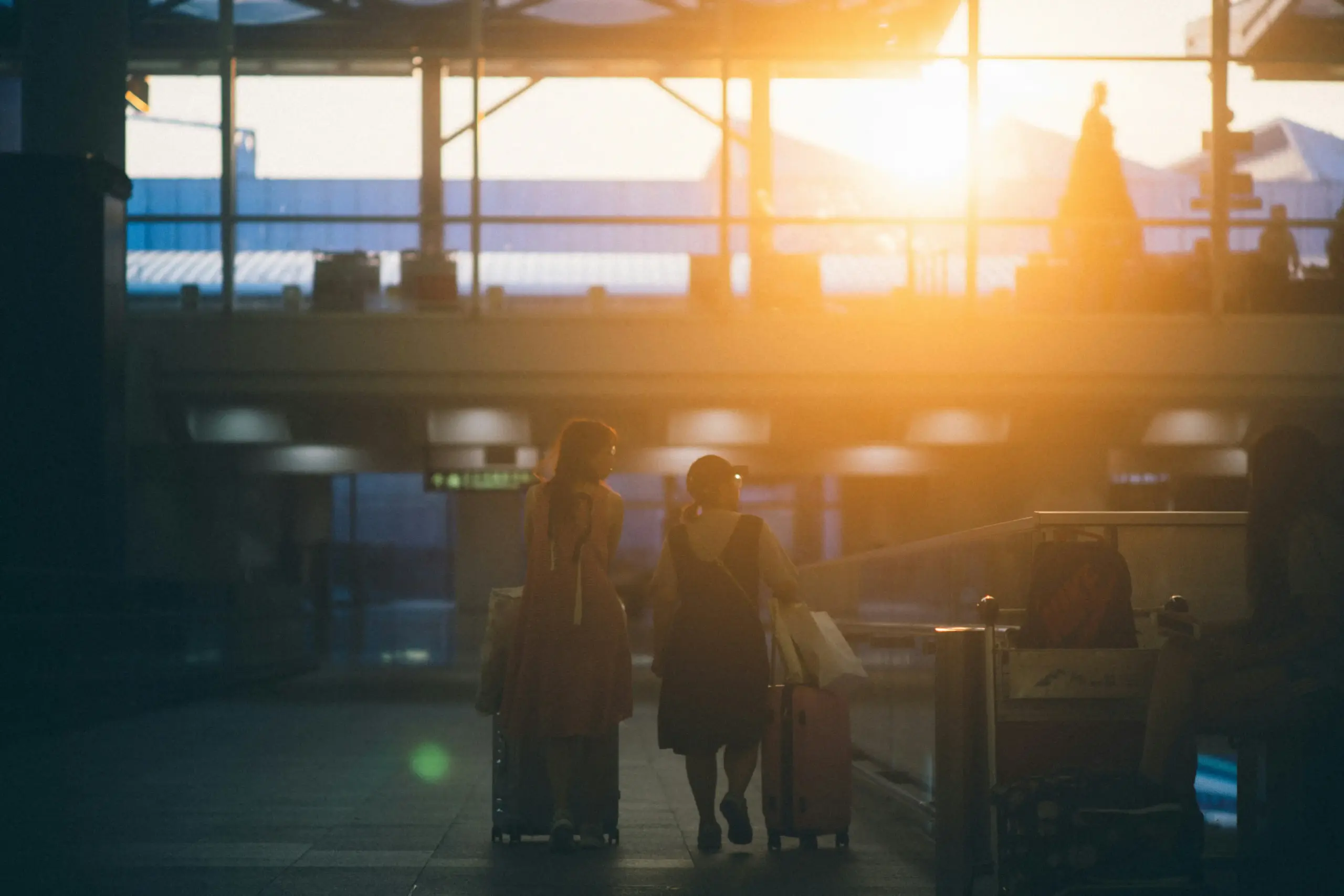 family with children and multiple suitcases being assisted by a chauffeur in a luxury SUV outside SeaTac airport