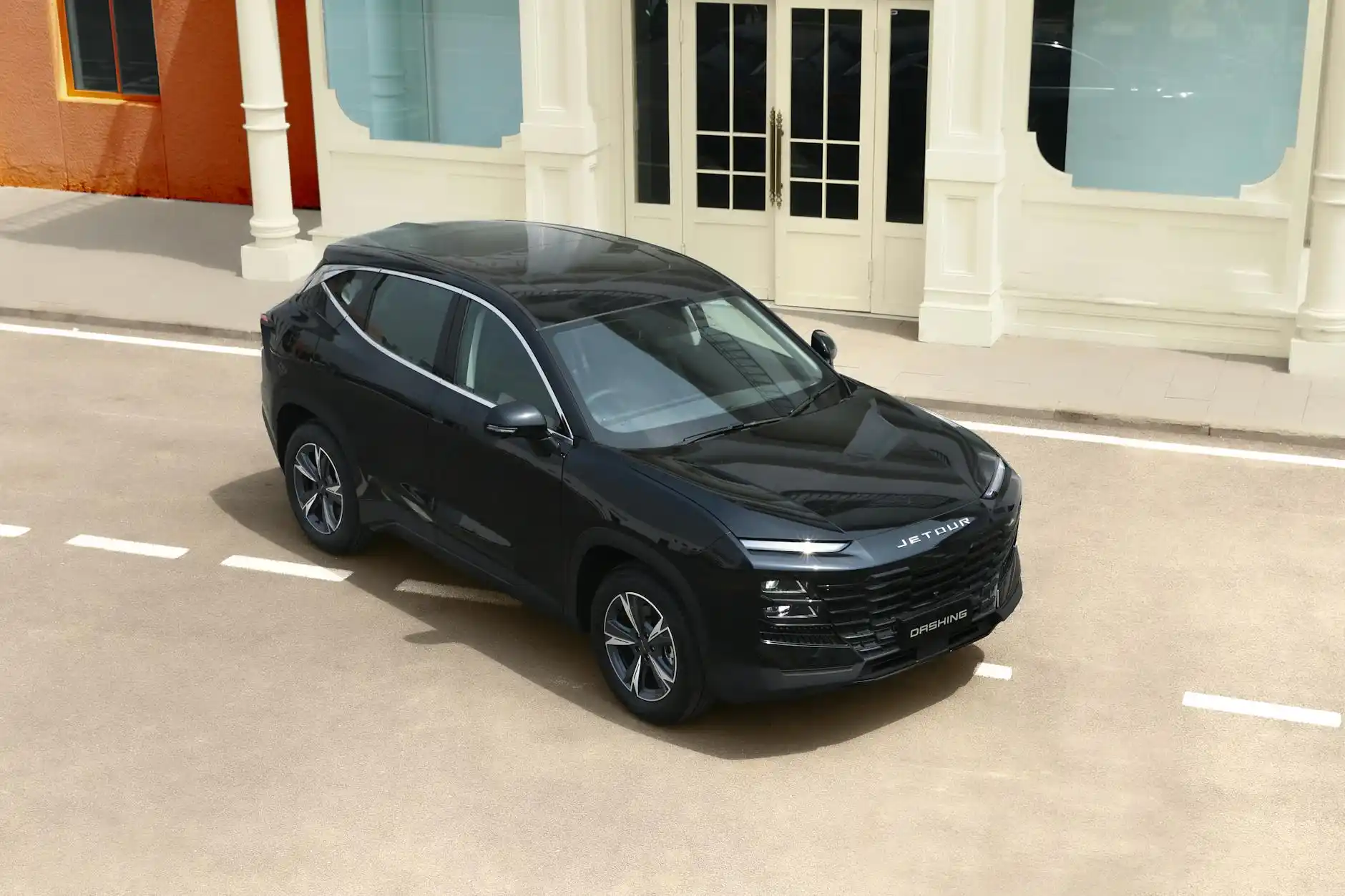 family with four rolling suitcases boarding a spacious black SUV outside a waterfront hotel in Seattle, ferry tickets visible, overcast Pacific Northwest morning