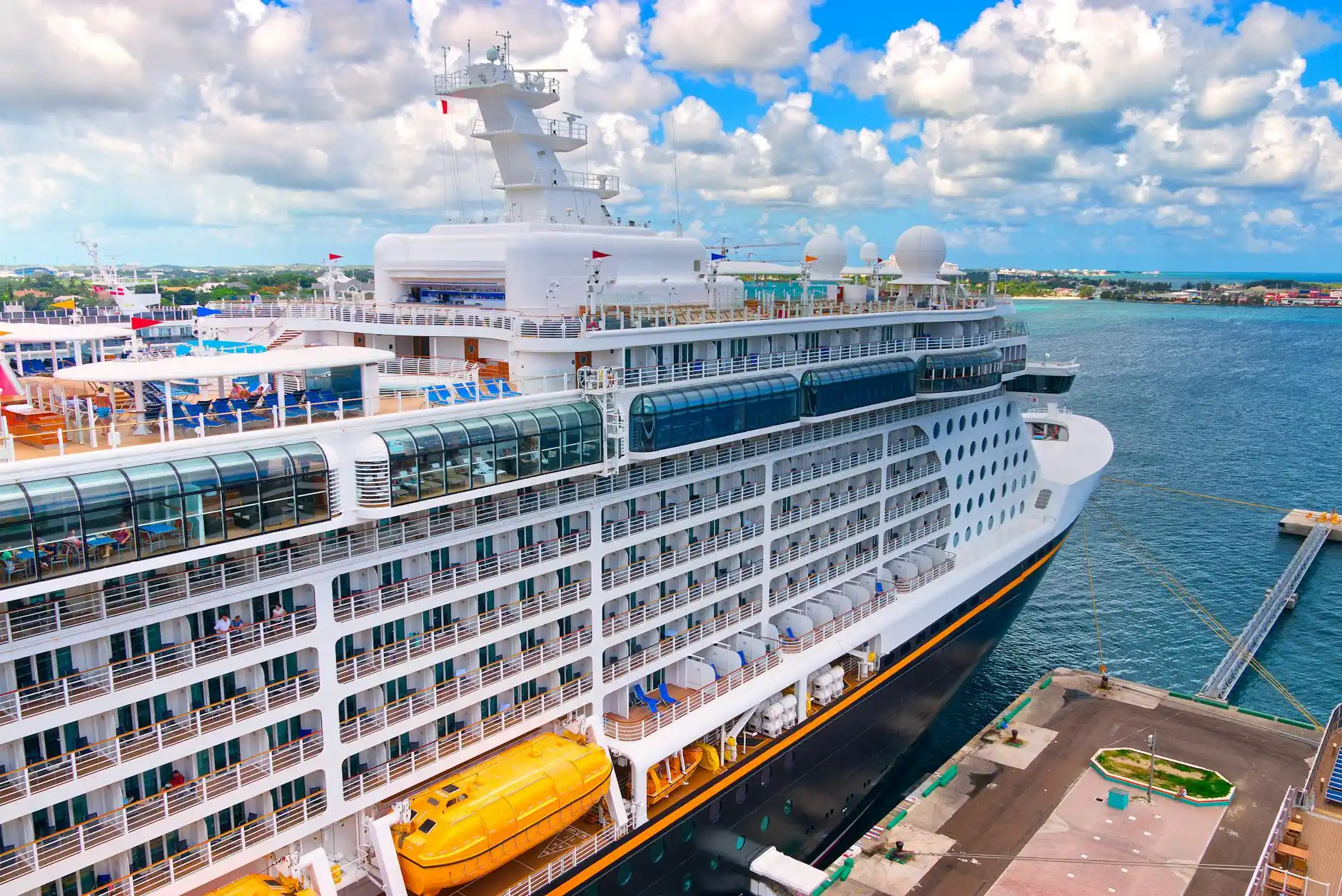 cruise terminal porter area at Pier 91 with uniformed staff loading tagged suitcases onto carts, passengers holding passports and boarding documents, black SUV unloading neatly ...