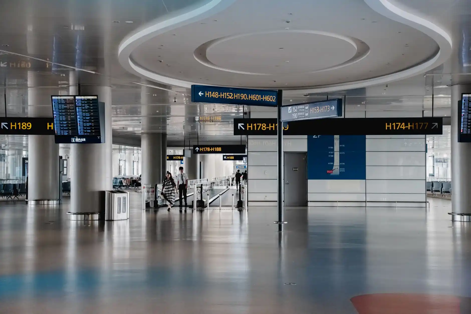 group of travelers meeting chauffeur at SeaTac airport arrivals, luxury Sprinter van waiting curbside, rolling suitcases and clear directional signage, realistic modern airport ...