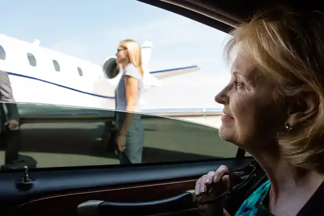 split scene showing airport pickup signage at Sea-Tac on one side and elegant wedding limousine departure on the other, realistic luxury transportation contrast